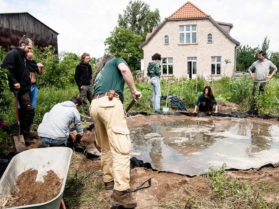 A practical exercise during the annual training programme: participants building a pond